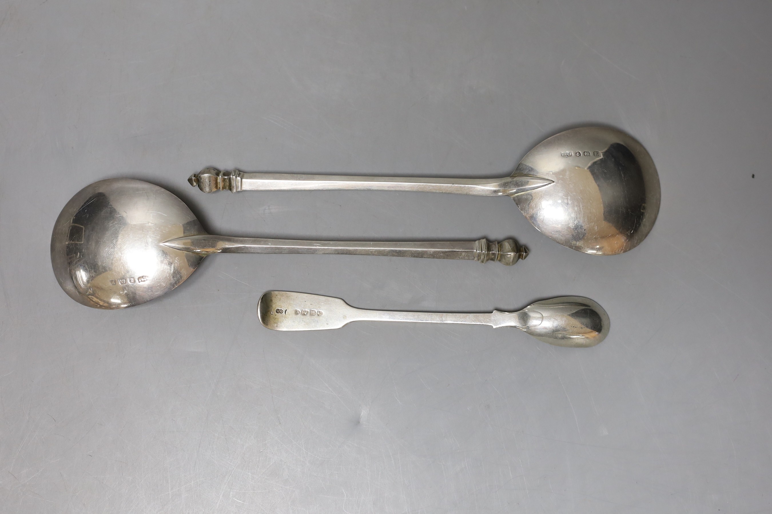 A pair of George V silver serving? spoons, Mappin & Webb, Birmingham, 1930, 19.1cm and an earlier silver condiment spoon, 152 grams.